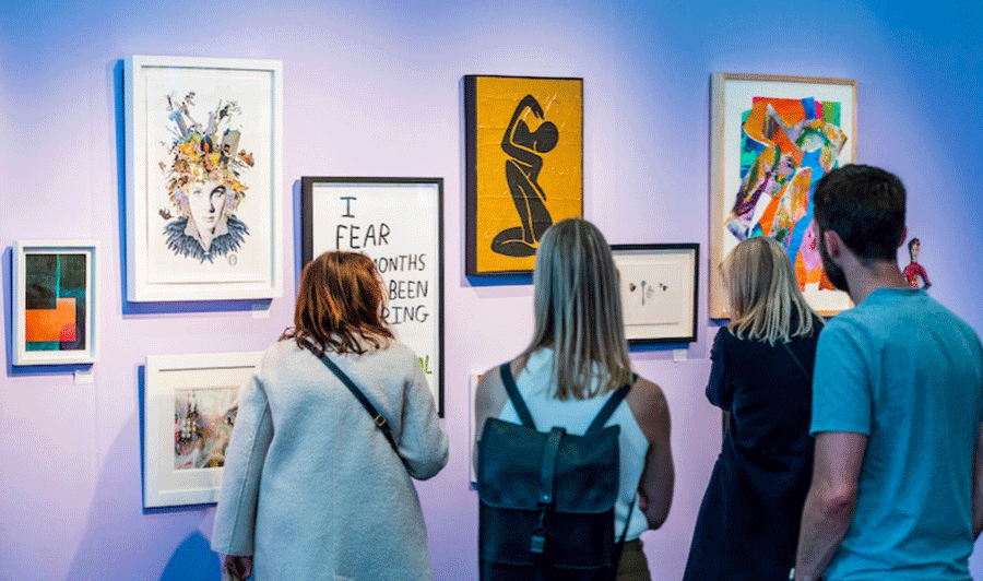 People looking at artworks at an art fair