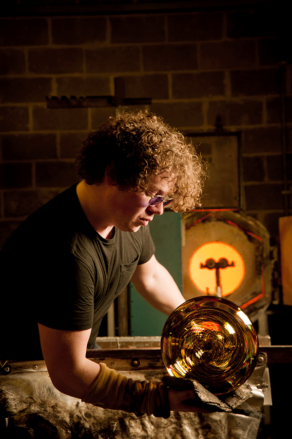 Glass sculptor Tim Rawlinson working in his studio